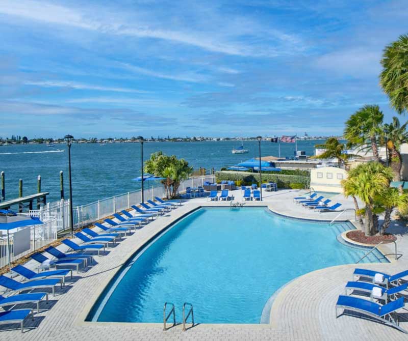 A shaded outdoor patio for mindful dining and social connection overlooking the Intracoastal Waterway.